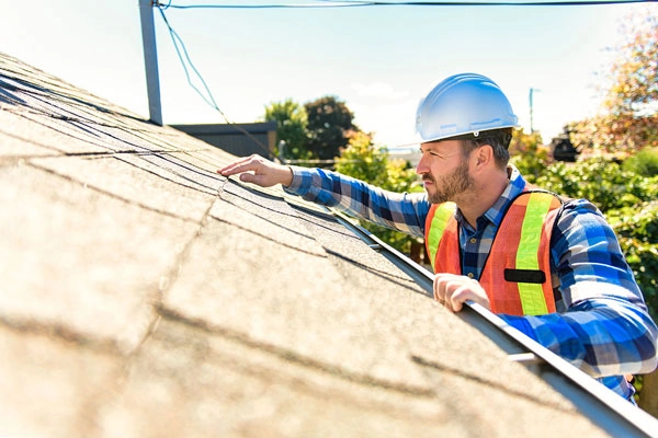 Employee inspecting roof